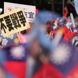 台湾総統選の投開票日を明日に控え開かれた中国国民党の集会で掲げられたプラカード＝2024年1月12日午後、台湾・新北（松本健吾撮影）　写真提供：産経新聞社